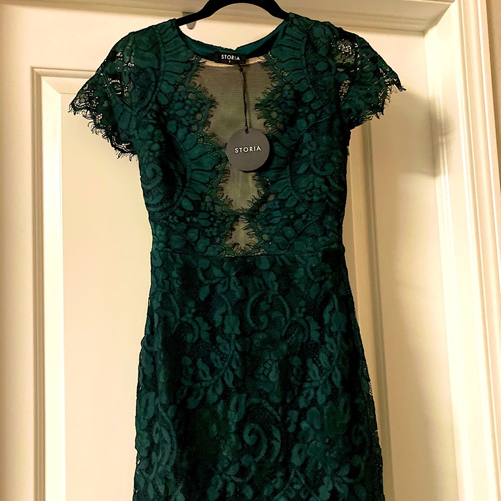 Emerald green small lace cocktail dress. Never worn from Red Dress Boutique.